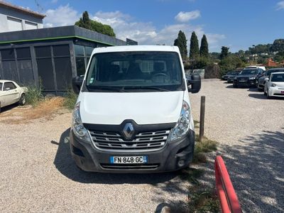 a white van parked in a parking lot next to a building