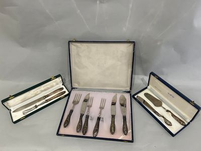 four silverware pieces in a case with a knife, fork and spoon