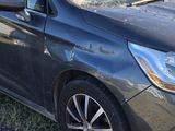 a car that has been damaged and is parked on the side of the road