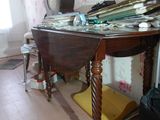 an image of a messy room with a table and chairs