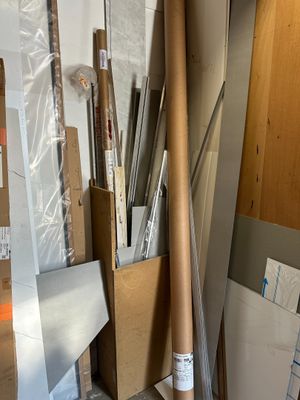 many rolls of paper and a roll of tape on the floor