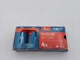 two batteries are in a box on a white surface