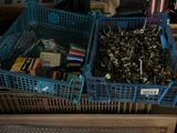 two baskets of tools sitting on top of a table
