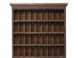 an old wooden bookcase with lots of compartments on top of it