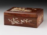 an image of a wooden box with birds and flowers on it