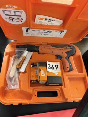 an orange tool box with tools in it sitting on top of a table