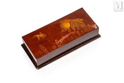 a small box with a painting on it on a white surface