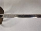 a close up of a knife on a white surface