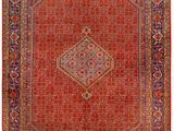 a red and blue rug with a diamond design