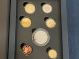 an image of a box with a set of coins in it
