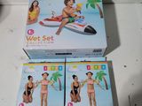 two boxes of wet set toys sitting on top of a table