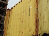 a yellow container sitting on top of a metal container