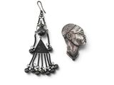 an image of a pair of earrings with a woman ' s face on it