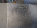 a metal plaque on the side of a machine