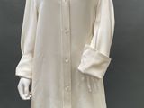 an image of a mannequin wearing a white shirt and white pants