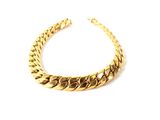 a close up of a gold necklace on a white background