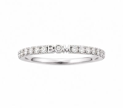 a white gold ring with diamonds on the side