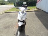 a scooter that is parked in a parking lot