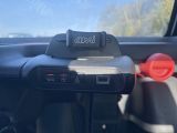 a close up of a car dashboard with a phone in it
