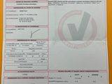 a close up of two papers on a table with a barcode on it