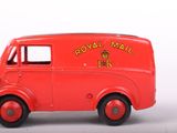 a red toy truck with a royal mail logo on it