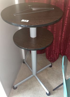 a small table with a laptop on top of it