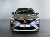 the front view of a silver car in a showroom