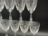a lot of wine glasses that are sitting on a table