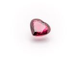 a heart shaped pink tourmaline gems on a white background