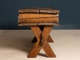 a small wooden table with a wooden top on the floor