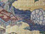 a picture of a tapestry with a picture of a japanese village