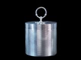 a close up of a metal container on a black background