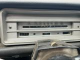 a close up of a radio in a car