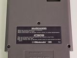 a close up of a nintendo game on a white surface