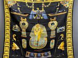 a black and yellow scarf with egyptian symbols on it