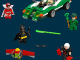 four legos of different colors and designs on a dark blue background