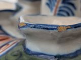 a close up of a bowl and a plate on a table