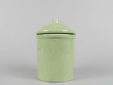 an image of a green ceramic jar with a lid on a white background
