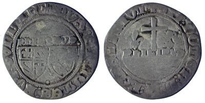 une pièce d'argent sur laquelle figure l'image d'un homme