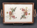 an image of a wooden tray with a floral design on it