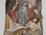 une image représentant un tableau où l'on voit Jésus allongé sur la croix dans une grotte