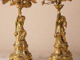 pair of antique brass candlesticks with cherenshes and cherenshes on them