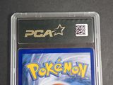 the pokemon game is in a plastic case on a table