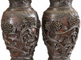 two vases that are sitting next to each other