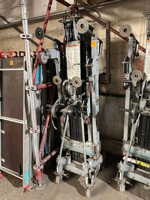 two machines that are sitting next to each other in a garage