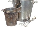 two buckets and a spoon sitting next to each other