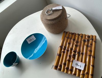 a small table with a bowl and a cup on it
