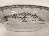 an image of a bowl with a blue and yellow design on it