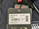 a black jacket with a red tag on it and a black jacket with a red tag on it