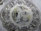 a plate with a picture of a woman and a bird on it
